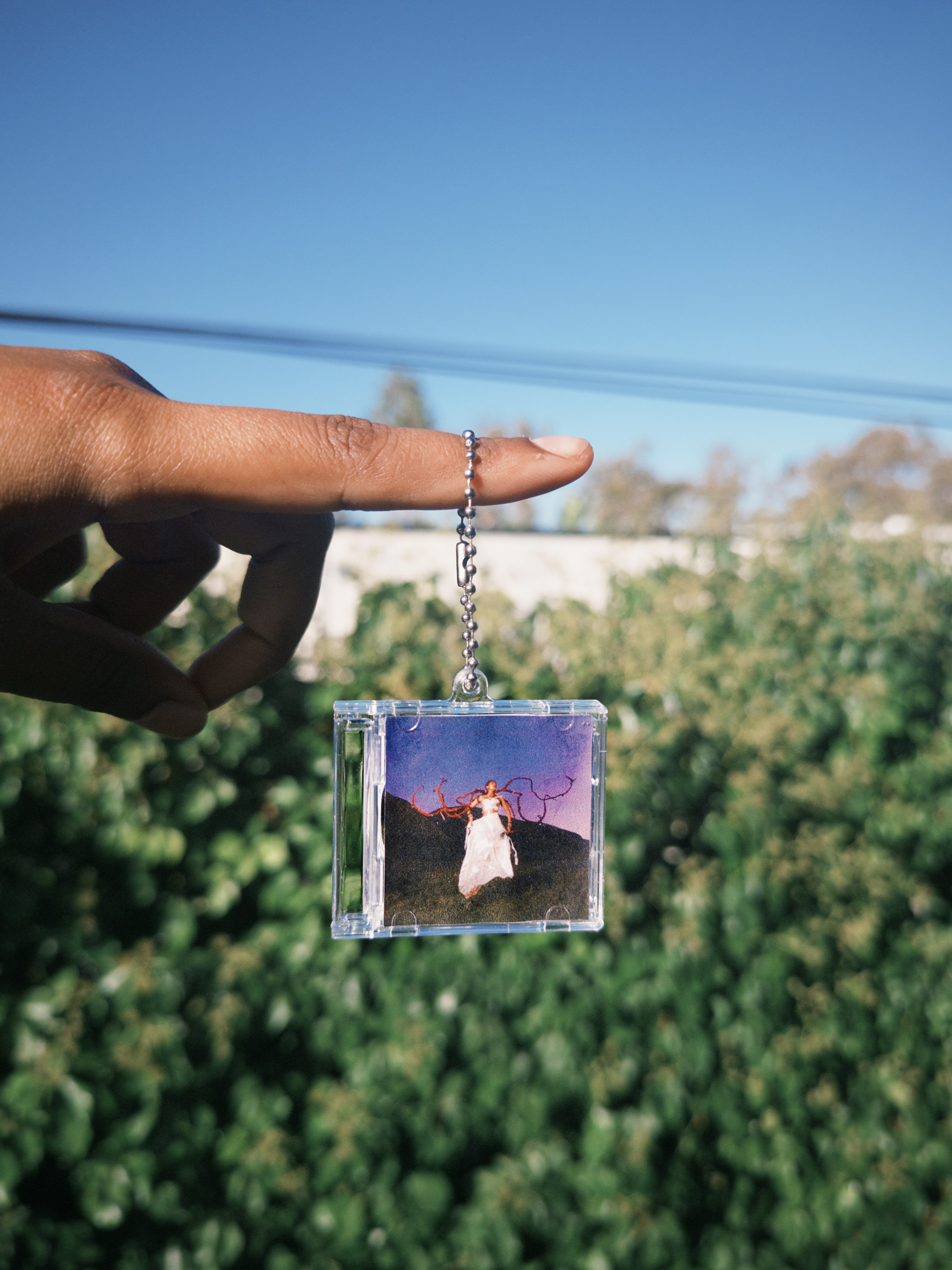 "pocket sized landing "CD keychain